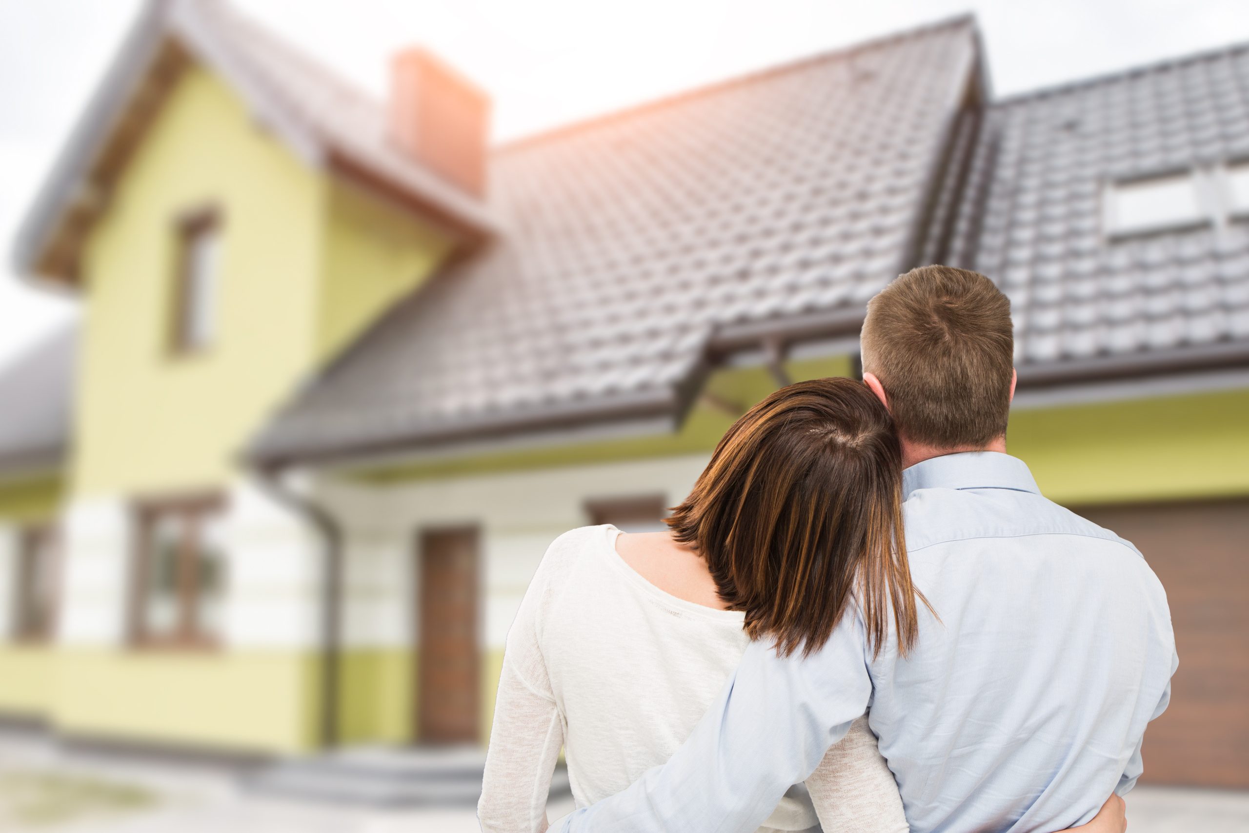 Young couple looking at dream house.